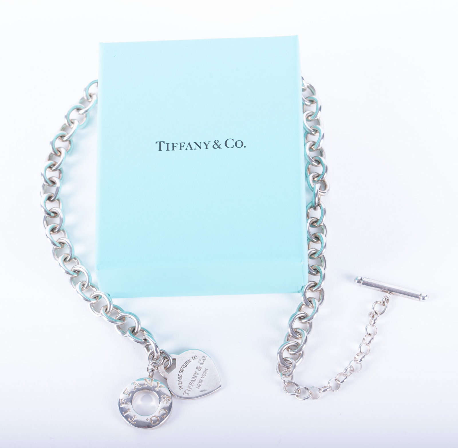 "Please Return to Tiffany & Co." Sterling Silver Necklace: "Please Return to Tiffany & Co." Sterling Silver Necklace This classic necklace is 14 inches long with a 3 inch extender chain. Weight is 70.4g. Cleaning cloth included.