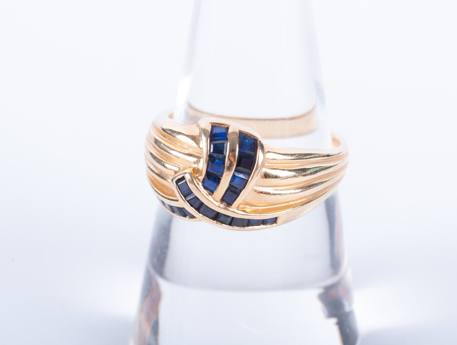 14K Yellow Gold Sapphire Ring: 14K Yellow Gold Sapphire Ring There are 20 square cut sapphires in graduating sizes. Ring size is 8 and the weight including stone is 4.7g.