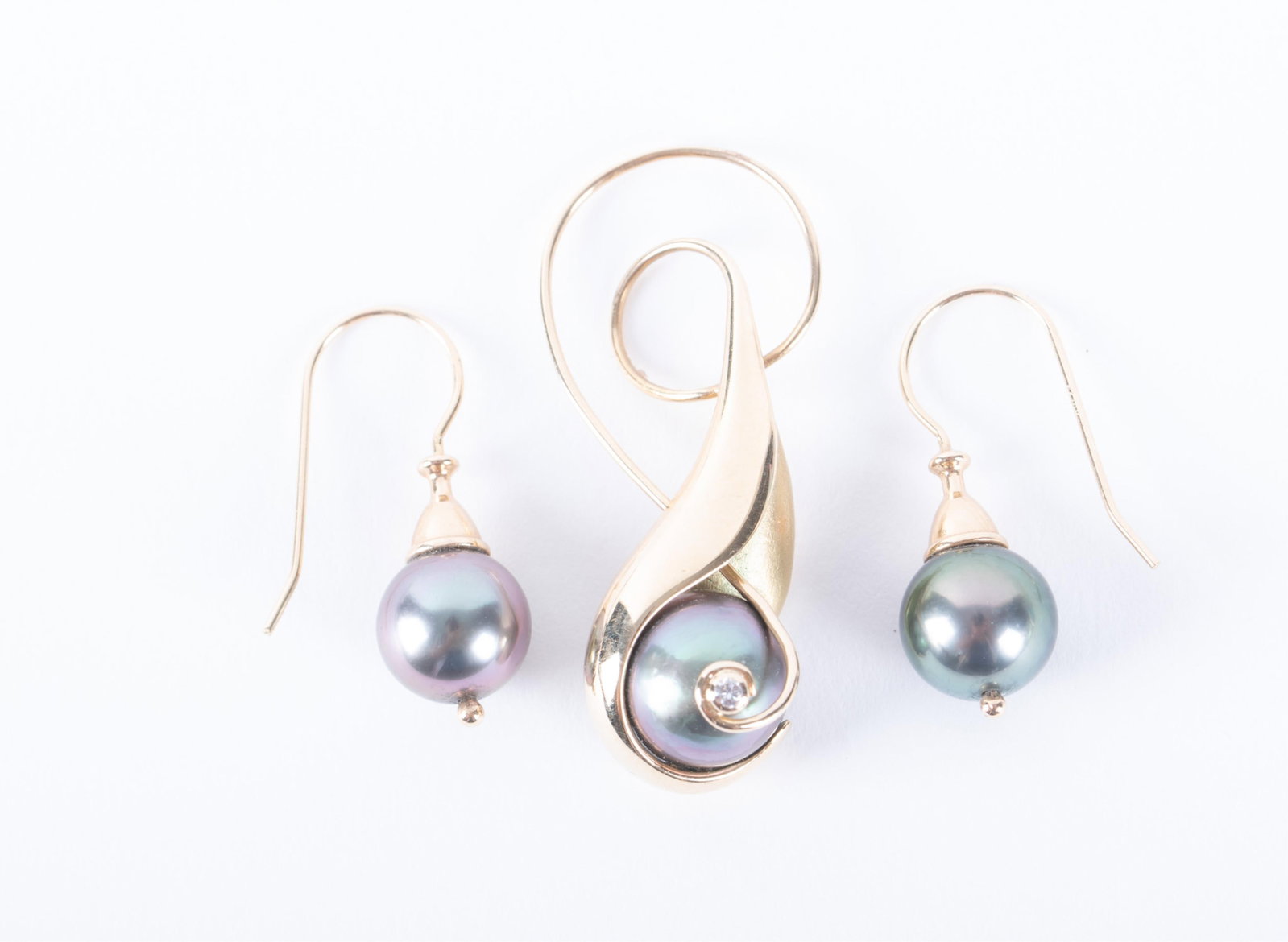 Tahitian Pearl Pendant & Earrings set in 14K Yellow Gold: Tahitian Pearl Pendant & Earrings set in 14K Yellow Gold This Contemporary design set is signed R Lagosch. The pearl in the pendant measures 10mm and has a small diamond within the setting. It is 1