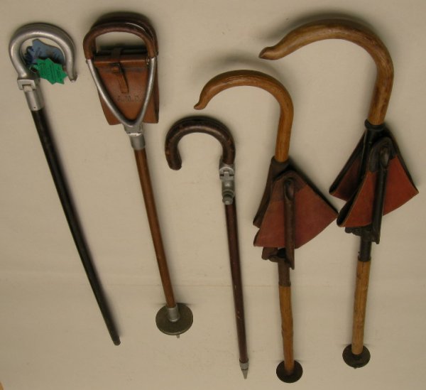 Antique Walking Sticks and Canes: A collection of shooting sticks and seats including 'The Perfect' made by Brigg of London, another alloy walker, two folding canvas seats and another (5)