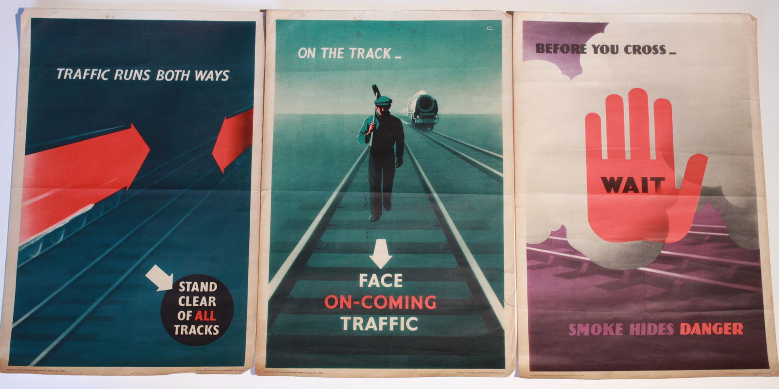 Leonard Cusden (1898-1979) Before You Cross, On the Track and Traffic runs both ways, three original: Leonard Cusden (1898-1979) Before You Cross, On the Track and Traffic runs both ways, three original posters printed for BR(LMR) by Macmillan 1955 - 45 x 21 cm (3)