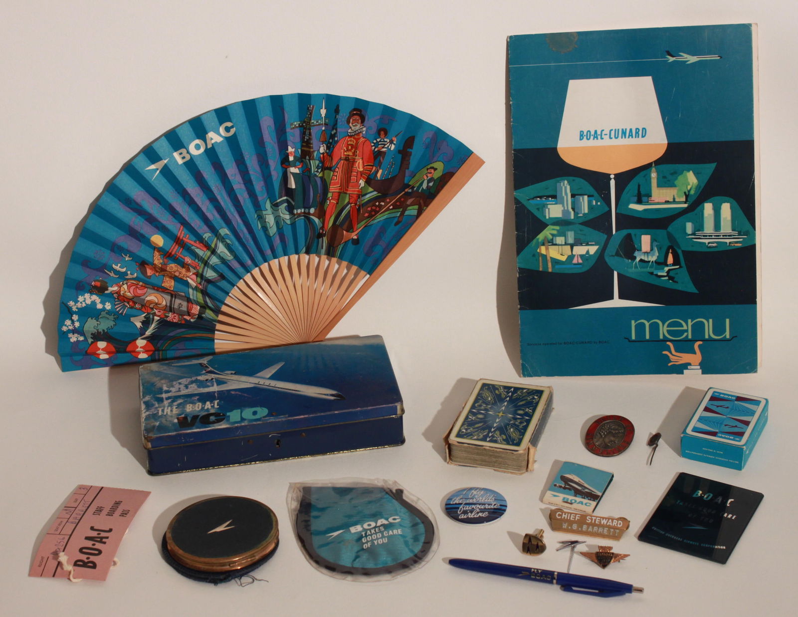 BOAC company ephemera, souvenirs and and badges, including unused fan in sleeve, crossing the: BOAC company ephemera, souvenirs and and badges, including unused fan in sleeve, crossing the equator certificate 1962, playing cards, powder compact, vanity mirror, eye masks (2), Guild of Sommeliers