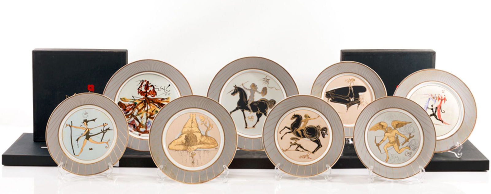 Set of plates in porcelain with decoration influenced: SALVADOR DALÃ Y DOMENECH Set of 8 plates in porcelain with decoration enameled in polychrome and gold according to designs of Salvador Dali, the titles are "Renaissance Narcissus" nÂº1368", "Mythol