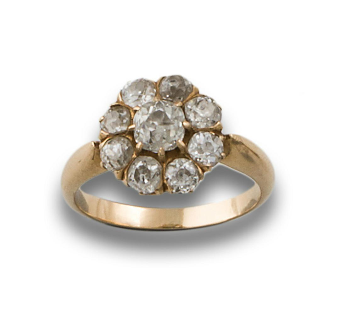 GOLD ROSETTE RING WITH DIAMONDS: 20 year old rosette ring in 18kt yellow gold, diamonds, antique cut, estimated total weight 2cts. . JEWELRY