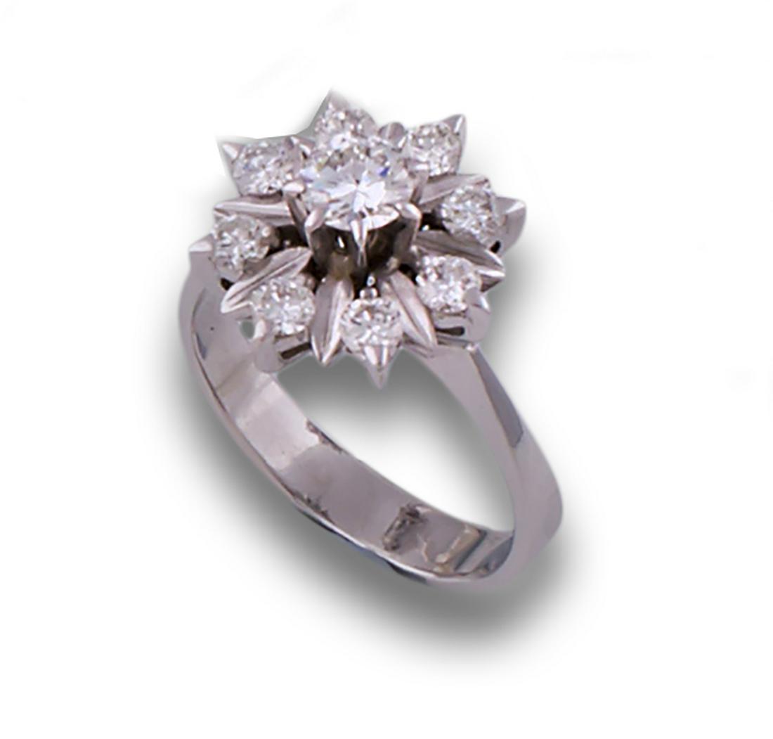 GOLD ROSETTE DIAMOND RING: 70's rosette ring, 18k white gold, with diamonds, brilliant cut, estimated total weight 0.80ct. .