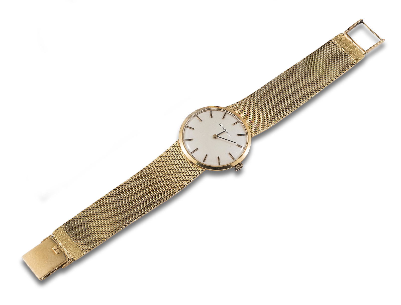 TIFFANY & CO WRISTWATCH IN YELLOW GOLD: Wristwatch TIFFANY & CO, 18kt yellow gold mesh case and bracelet movement, hand-wound mechanical movement, No. 917.144/3281. Movement signed TISSOT. White dial with black hands. In running order.