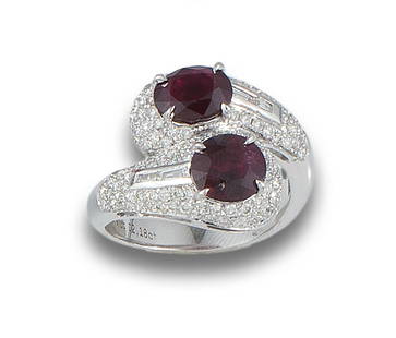 Ring you and me in 18 kt. white gold.: Formed by two natural Burma rubies, unheated, oval and cushion cut, total weight 4.46 ct. with diamond studded arms, brilliant and baguette cut. Certificate C. DUNAIGRE, SWITZERLAND, No. CDC1904418 AN