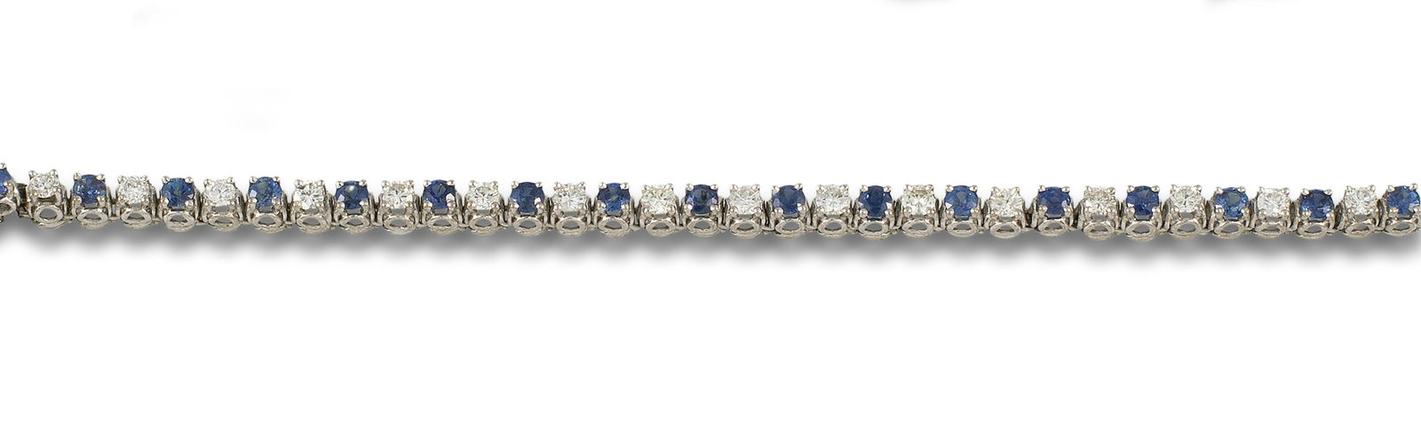 18kt. white gold riviere bracelet with 19 diamonds and 19 sapphires. (1 of 1)