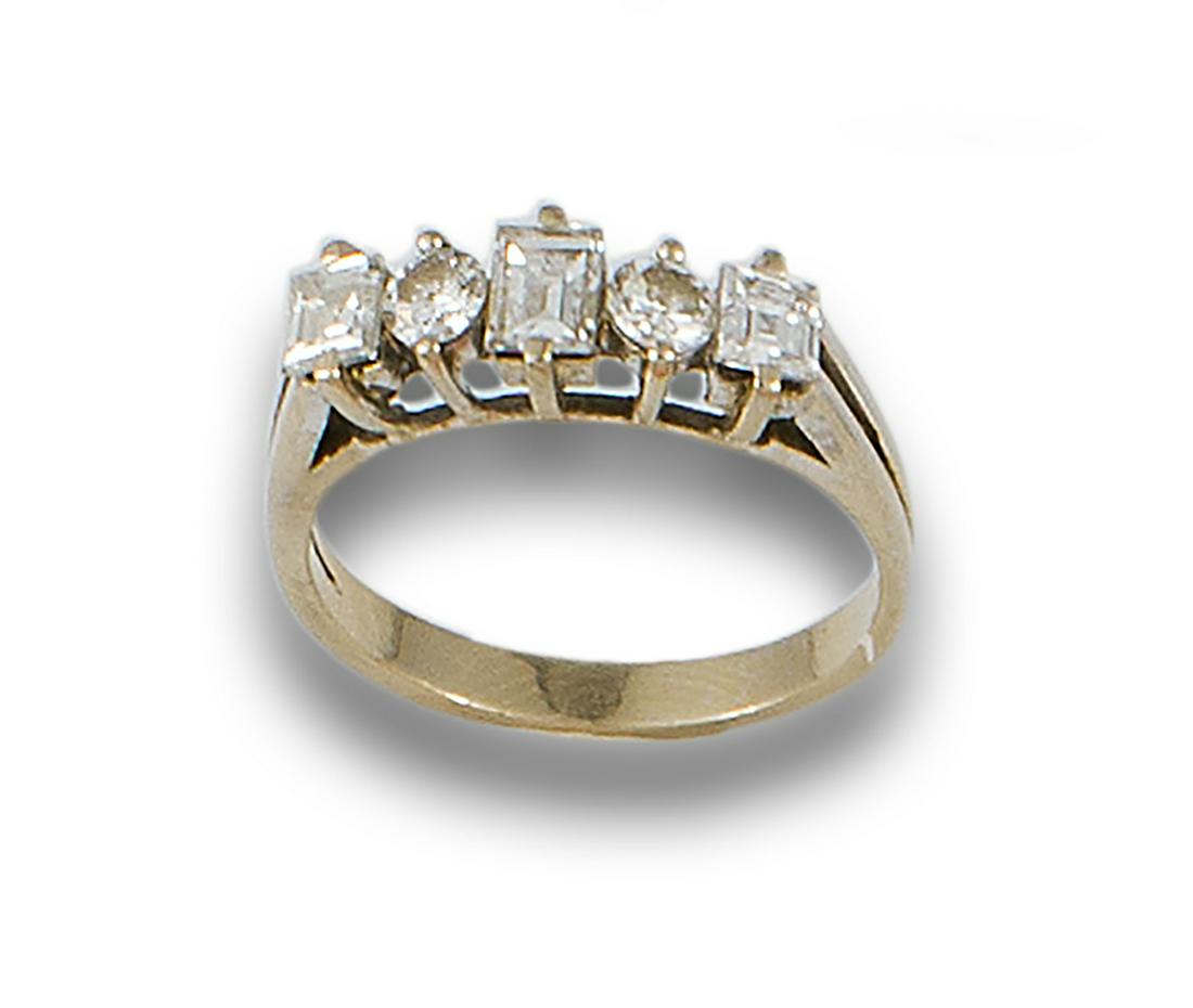 18kt yellow gold ring made up of an emerald-cut diamond, two brilliant-cut diamonds and two (1 of 1)