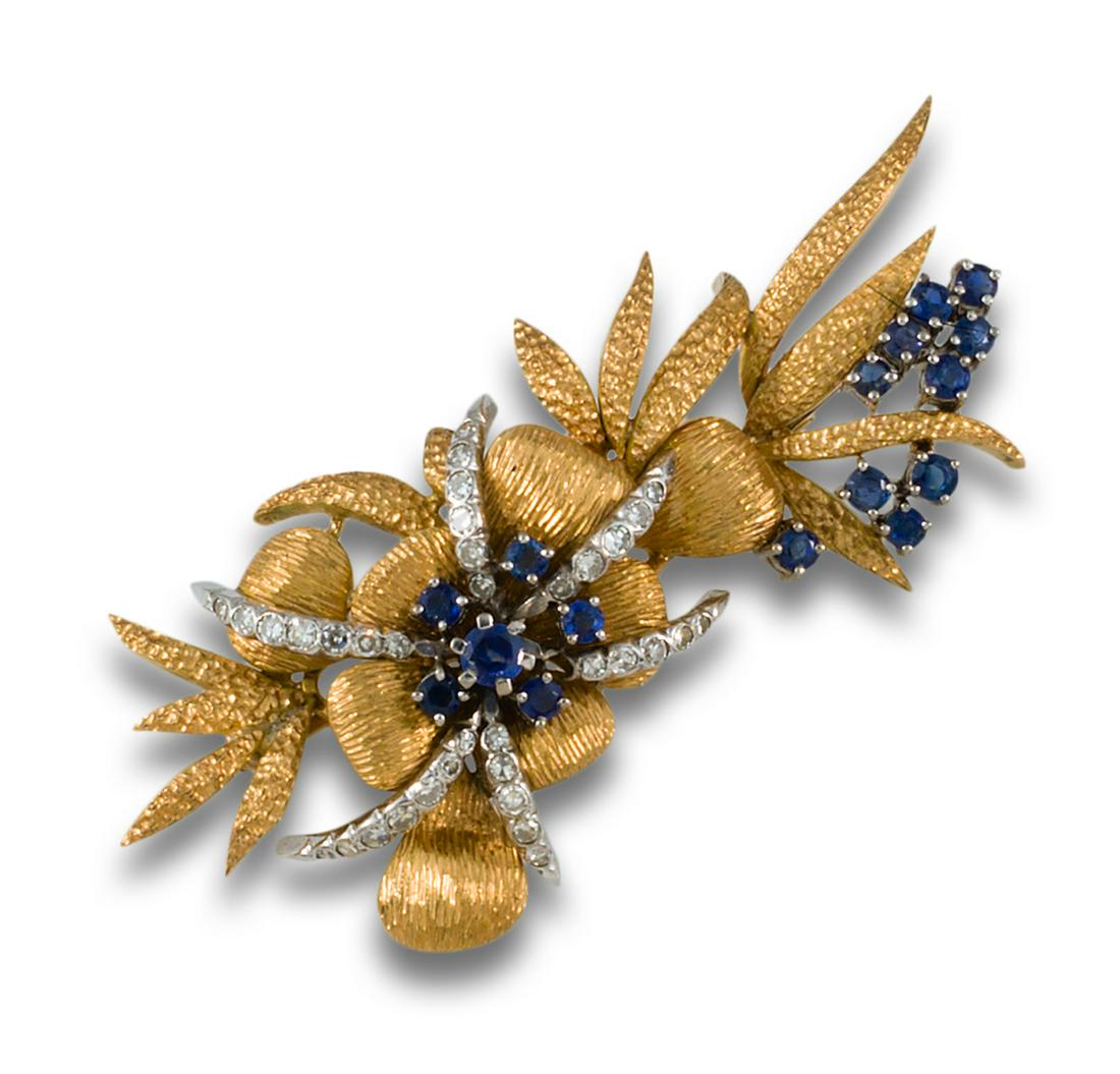 18kt. yellow gold flower brooch with 18kt. white views, formed by brilliant-cut sapphire centres and (1 of 1)