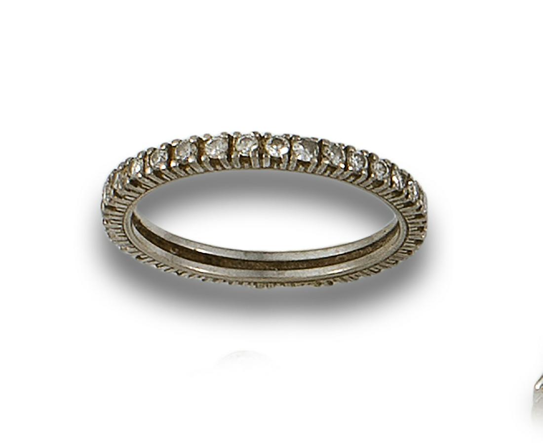 18kt white gold eternity ring set with brilliant-cut diamonds in claw settings. (1 of 1)