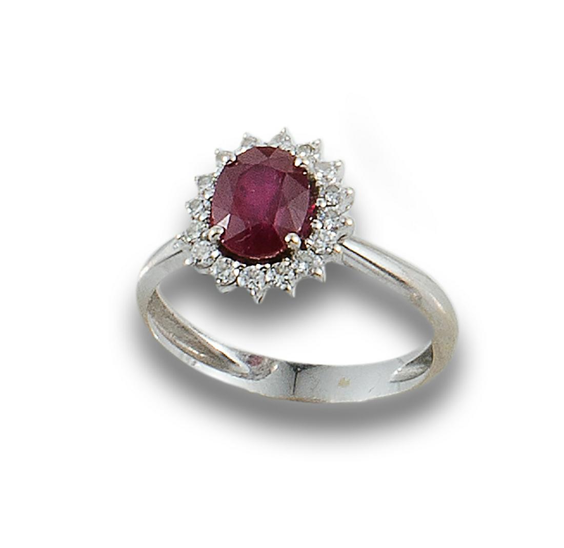 Platinum ring formed by a central square emerald and single cut diamond details. (1 of 1)