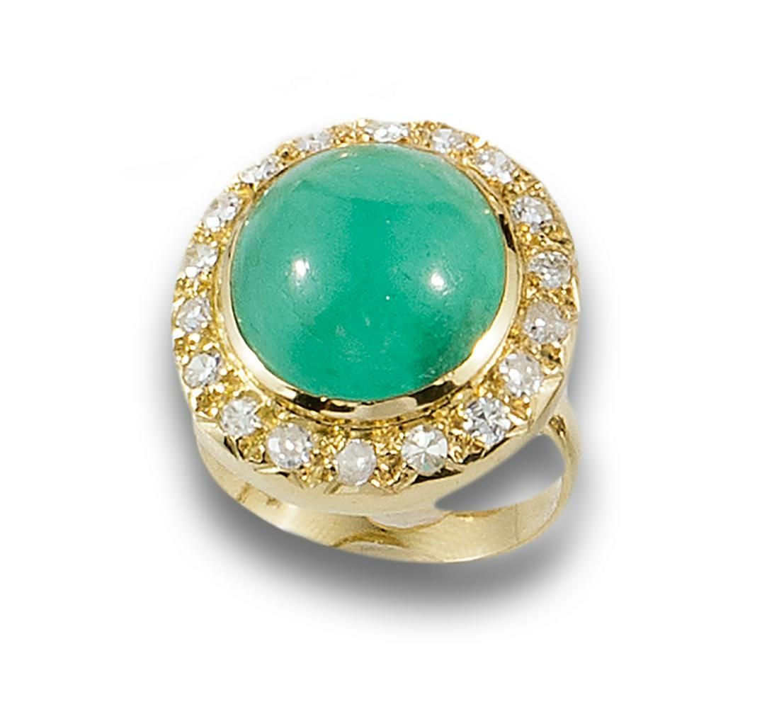 Formed by an oval emerald cabochon and diamond border, cut (7(. (1 of 1)