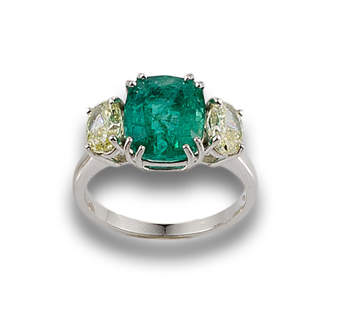 Formed by a central emerald, cushion cut, estimated at 4.10 ct. and flanked by two fancy diamonds, (1 of 1)
