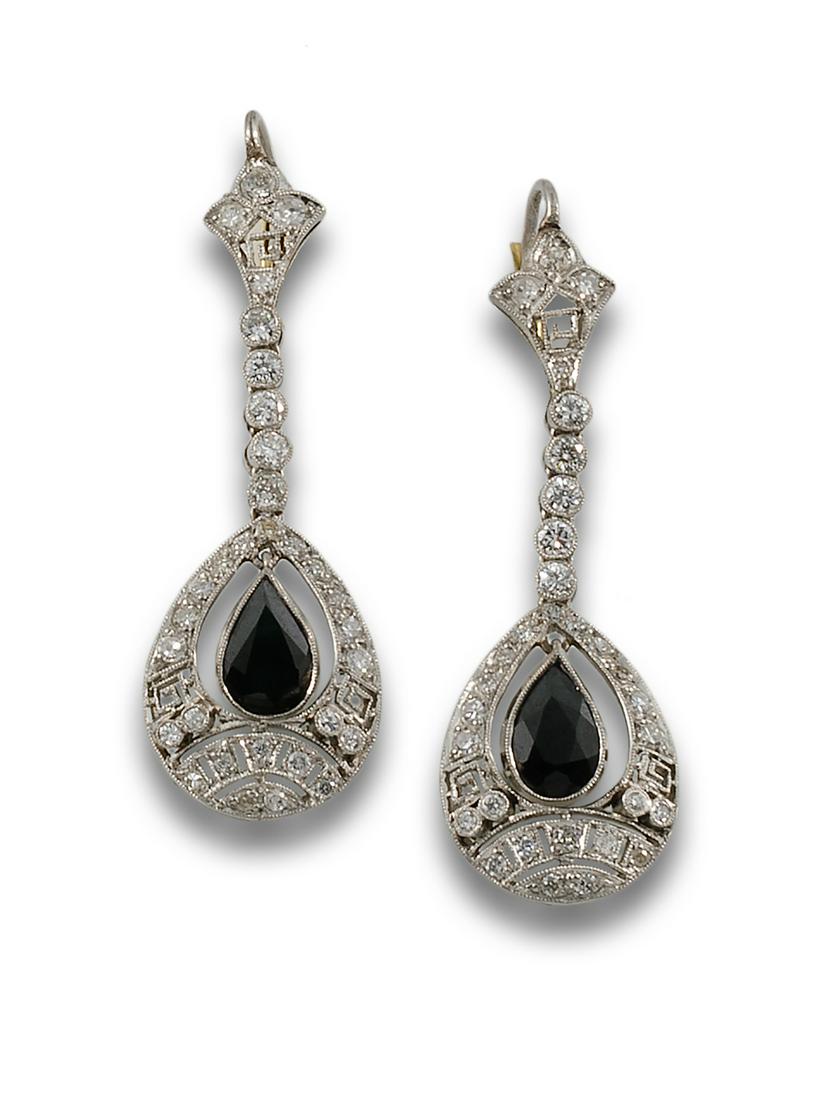 Formed by a geometric design studded with brilliant cut diamonds, with a sapphire knob hanging (1 of 1)