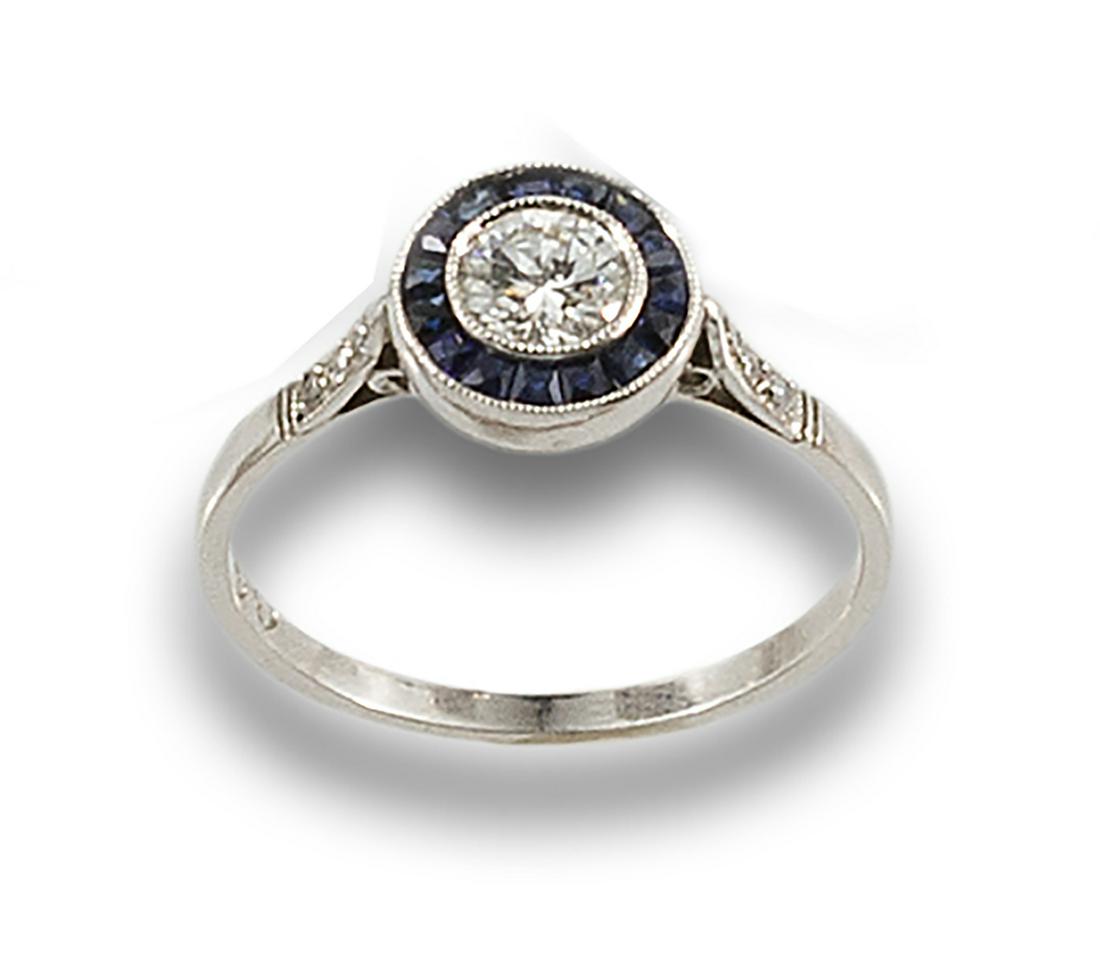 Formed by a central diamond, brilliant cut, estimated at 0.30 ct., set in chaton and bordered with (1 of 1)