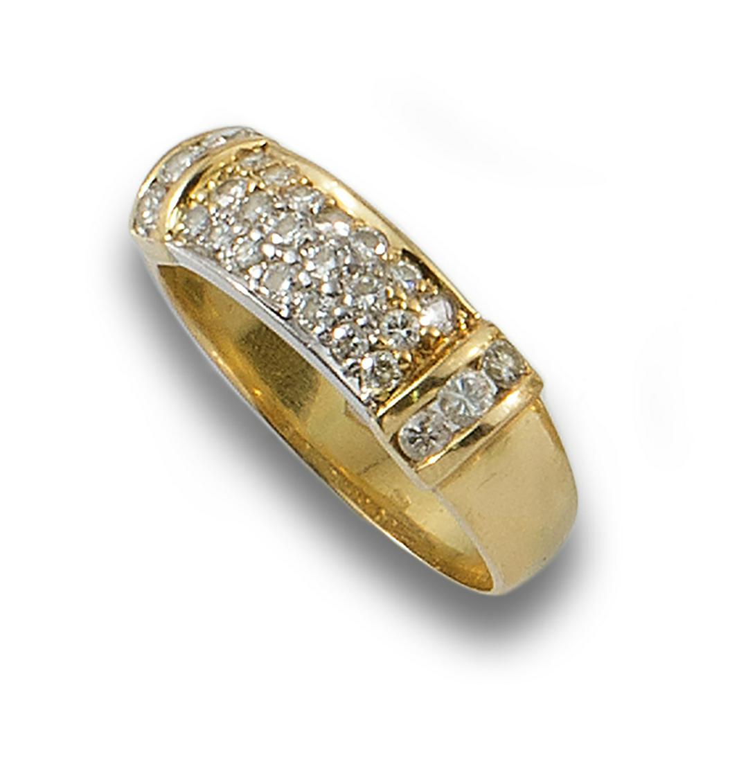 Formed by a center studded with diamonds, brilliant cut, set in grain and rail. (1 of 1)