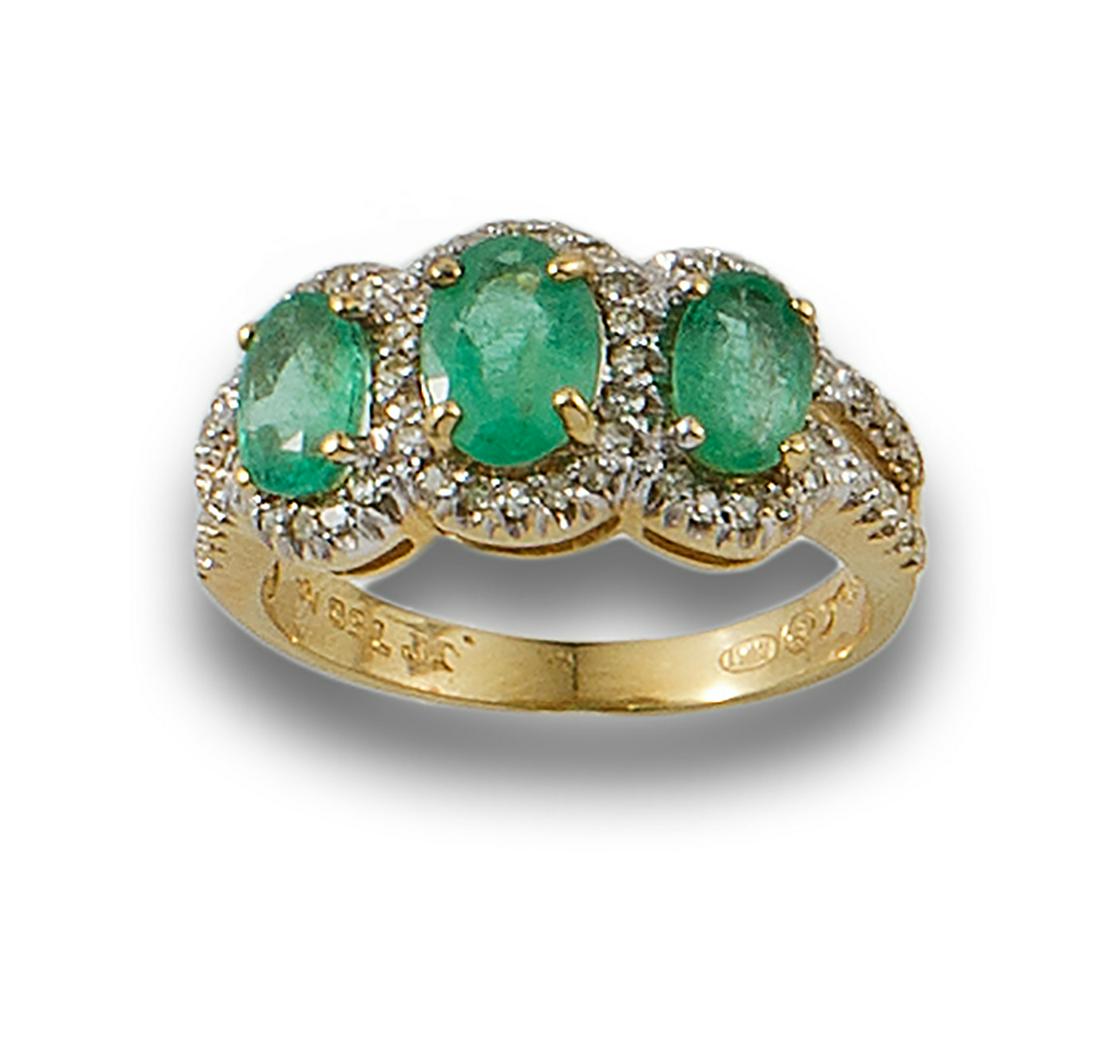 Formed by three rosettes of central emeralds, oval cut, bordered with diamonds, brilliant cut. (1 of 1)