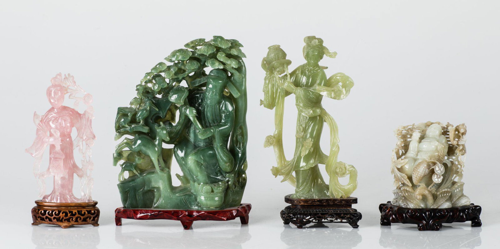 "Buddha", carved jade figure, China, 20th century: On a carved and stained wooden base. Measurements: 13 x 13 x 10 cm, total