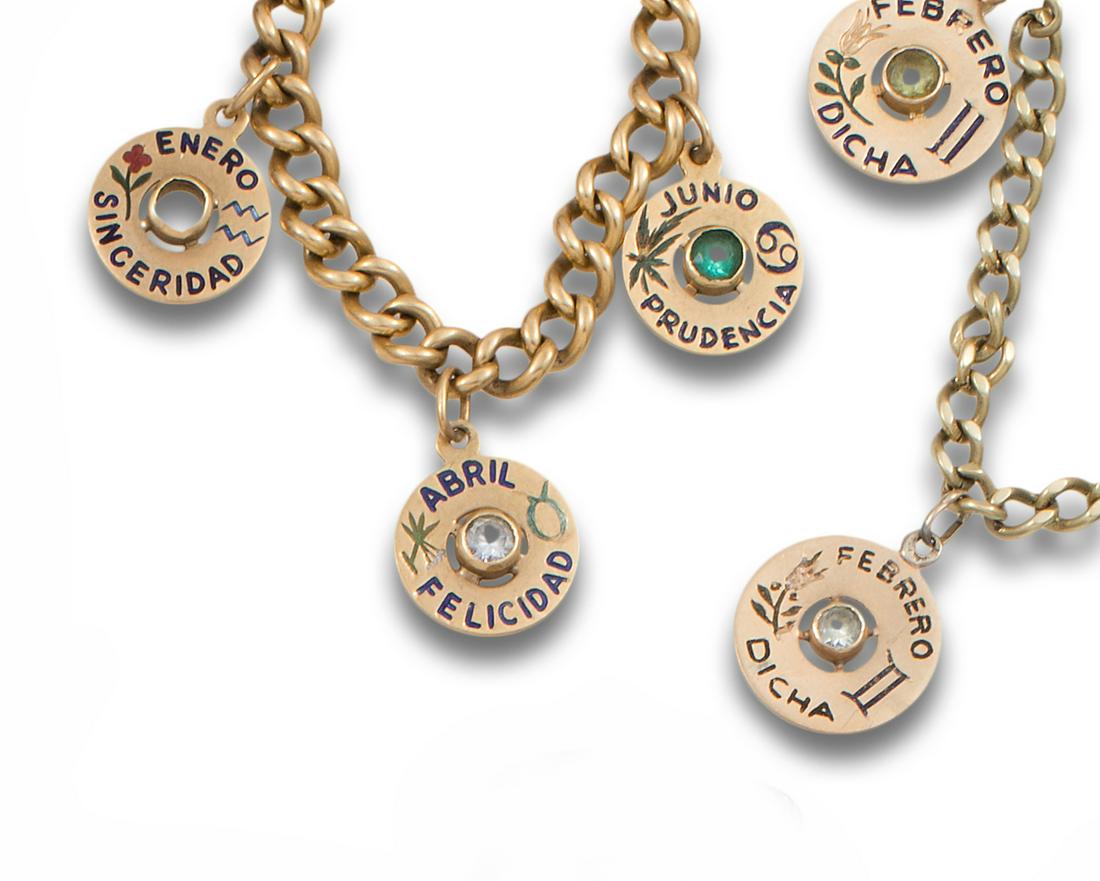 TWO GOLD BRACELETS WITH MEDALS OF THE MONTHS: Lot of two 18 kt yellow gold link bracelets. one with two "FEBRUARY-DICHA" medals and with four "JANUARY-SINCERITY", "FEBRUARY-DICHA", "APRIL-HAPPINESS" and "JUNE-PRUDENCIA" medals. Weight: 35.3 gr..