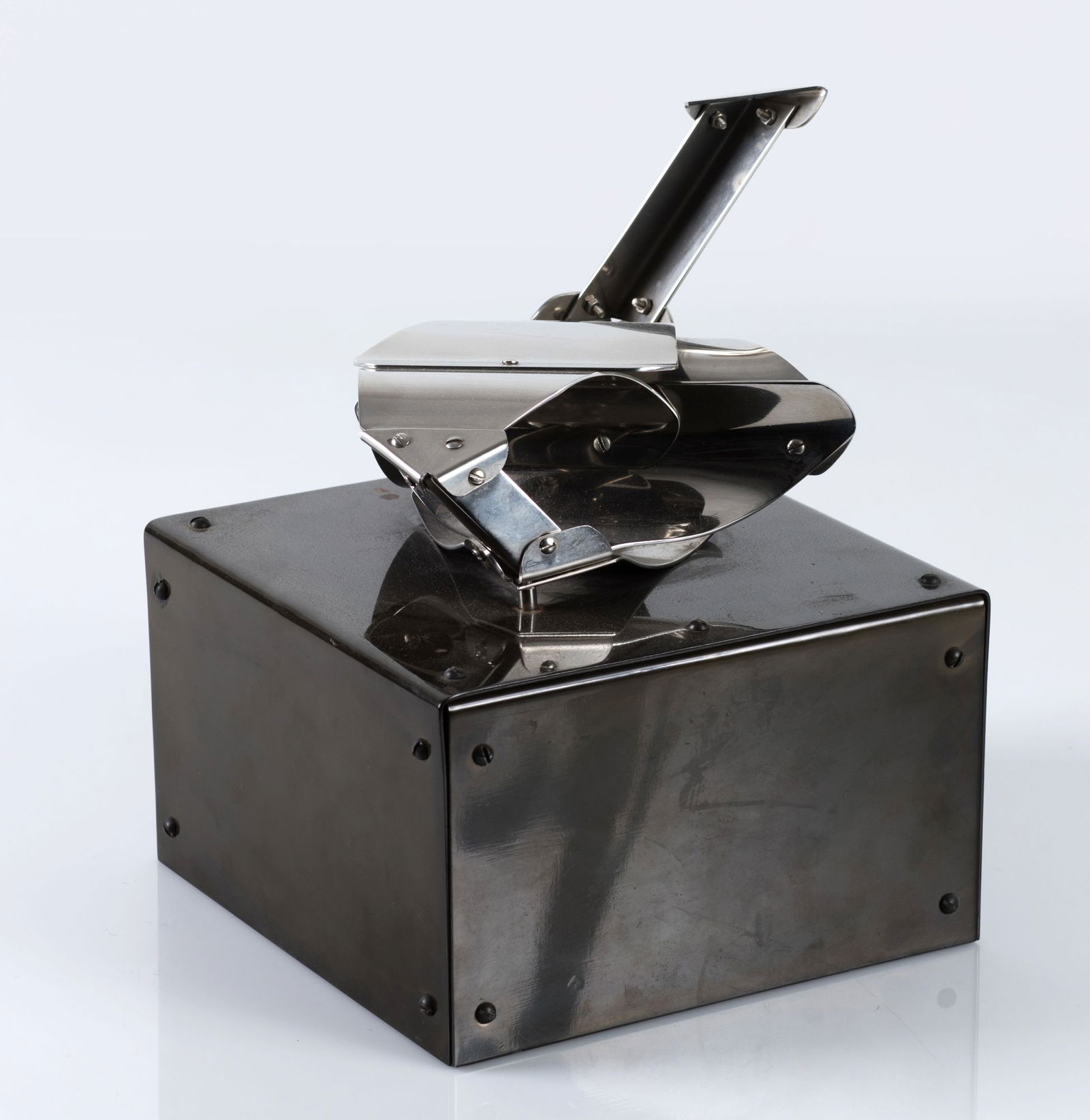 EDGAR NEGRET Popayan (1920) / BogotÃ¡ (2012) "Machu Picchu": Stainless steel sculpture Signed and justified 5/75 on the base. On painted metal base Measurements: 26 x 20 x 20 cm