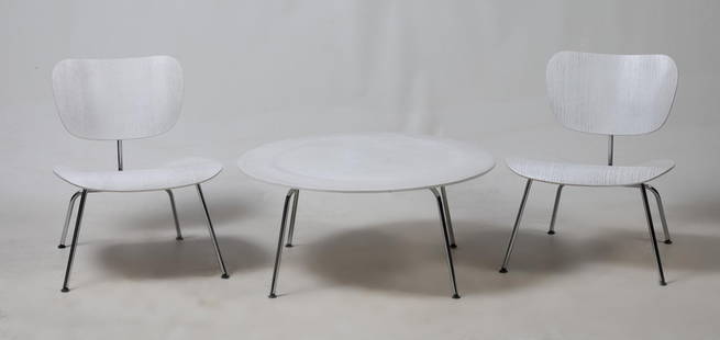 Pair of chairs and table designed by Charles and Ray Eames, 20th century: LCM model chairs and CTM table from the Plywood Group collection. Edited by Vitra. Made of steel and plywood. With stamps and labels Measurements: 66 x 55 x 55 cm