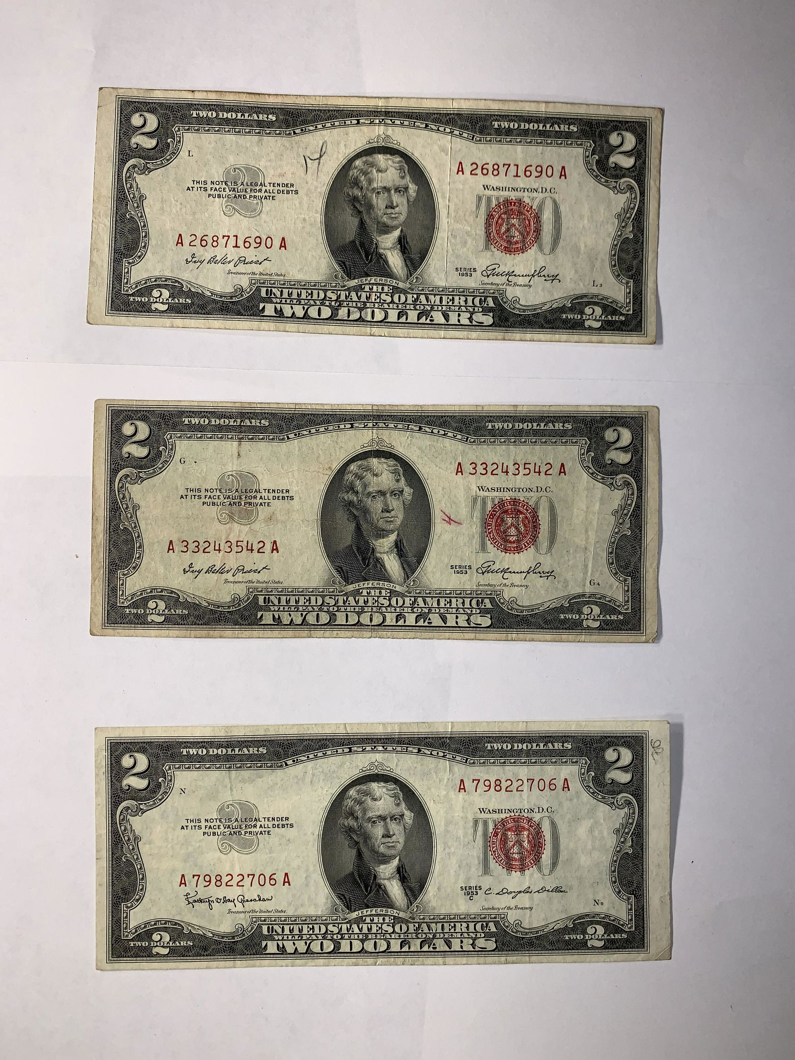 (3) 1953 Two Dollar Bill Red Seal $2 Banknote lot of 3: 1953 C and (2) 1953 Series Two Dollar Bills Red Seal US Currency $2 Banknote. Nice red seal notes. all AA block note. little pencil marks and pen marks see photos you receive exact three pictured noth