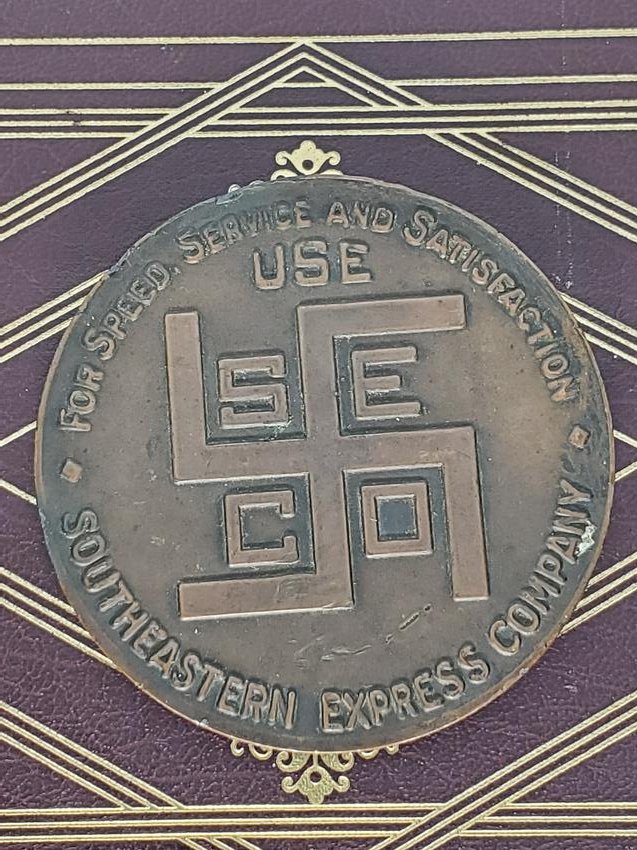 SOUTHEASTERN EXPRESS COMPANY PAPERWEIGHT: BRASS BRONZE NOT SURE WHAT METAL IS paperweight measures 3 ¼Â” diameter each side reads, Â“For Speed, Service and Satisfaction USE Southeastern Express Company with logo in center. Good u