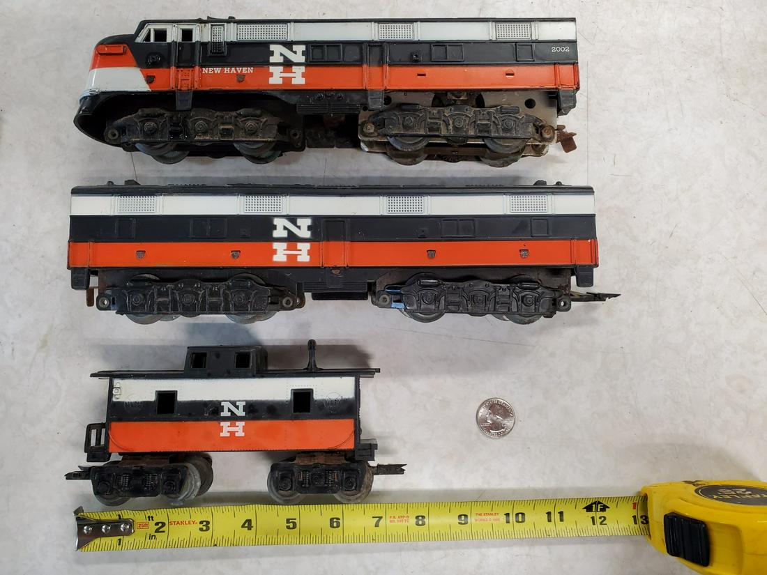 MARX NEW HAVEN E SERIES Locomotive#2002 With Caboose: MARX NEW HAVEN E SERIES A:B Diesel Locomotives #2002 With Caboose .......u get what you see the working condition of locomotive is unknown. ....see pictures the transformer thing powers on. shipping w