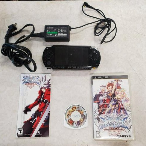 Fat PSP 1001 b2 with blazblue game, complete, tested: Fat PSP 1001 b2 with blazblue game, complete, tested, working. Some scratches, dings, dents; one chip in approximate center of screen. Does not affect playability. Did not test game all the way throug