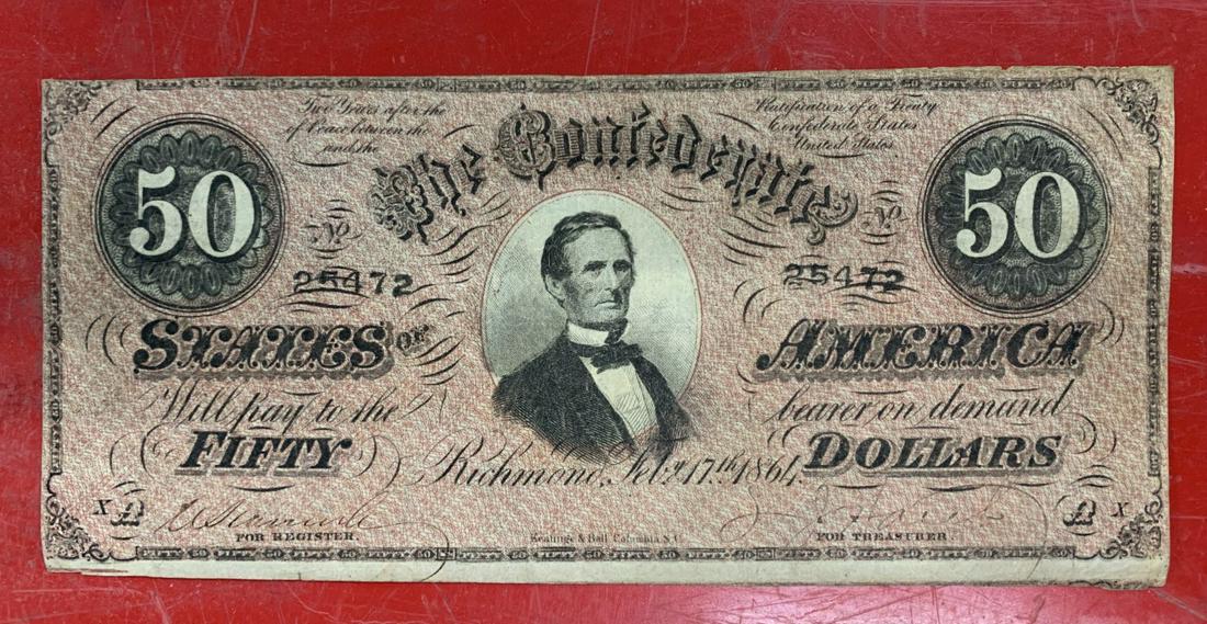 1864 CONFEDERATE STATES OF AMERICA 50 DOLLAR NOTE: 1864 CONFEDERATE STATES OF AMERICA 50 DOLLAR NOTEIN USED CONDITION VERY EVIDENT THIS WAS HAND CUT INK IS GOOD AUTHENTIC. COLORS ARE GREAT TOO ONE PIN HOLE ABOVE HIS HEAD