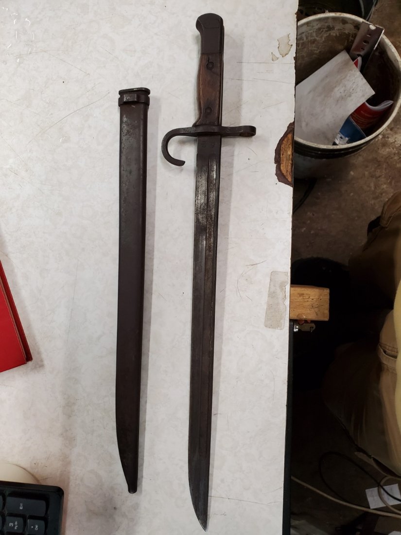 Type 30 Arisaka bayonet 三十年式: from Wikipedia: "Early Type 30 bayonets usually sported a hooked quillion guard which was designed to catch and trap the enemy's blade. By 1942 the quillon was eliminated to save materials and decreas