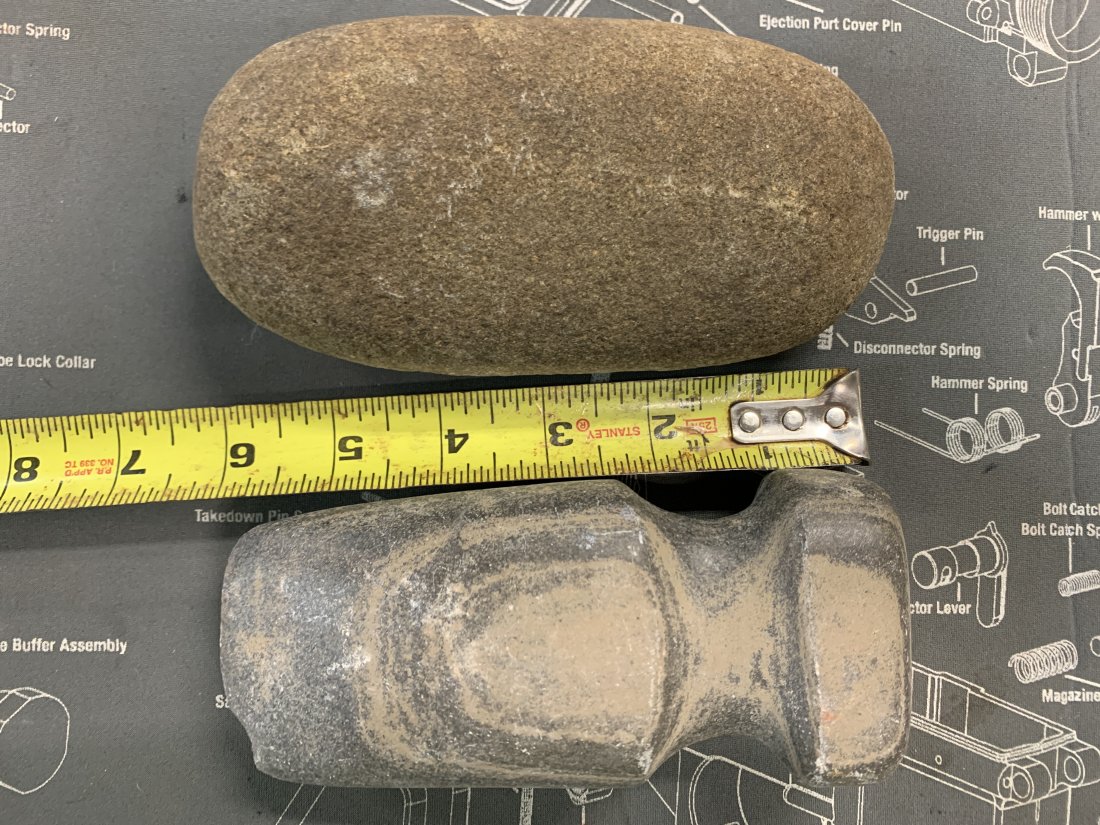 TWO LARGE IMPLEMENTS: ONE LOOKS LIKE A ROCK AND THE OTHER LOOKS LIKE A HATCHET DUNNO! REMEMBER WE HAVE NO IDEA AS TO THE ORIGIN OF THESE ITEMS, STUDY PICTURES CLOSELY ASK QUESTIONS OR VIEW IN PERSON DAILY NOON TO FIVE. If 
