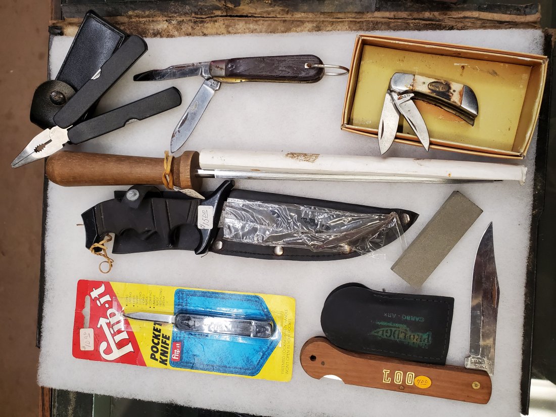 Sharpening stone, rat tail sharpener, 5 knives: SEE PICTURES FOR DETAILS. SOME RUST, SCRATCHES, DINGS, DENTS. ELK HORN LOOKS LIKE ITS HANDLE MIGHT HAVE SOME ROT? NOT SURE. KLEIN KNIFE, CHINA MULTITOOL, FLIP-IT KNIFE IN PACKAGE, LOO CHINA KNIFE, ELK