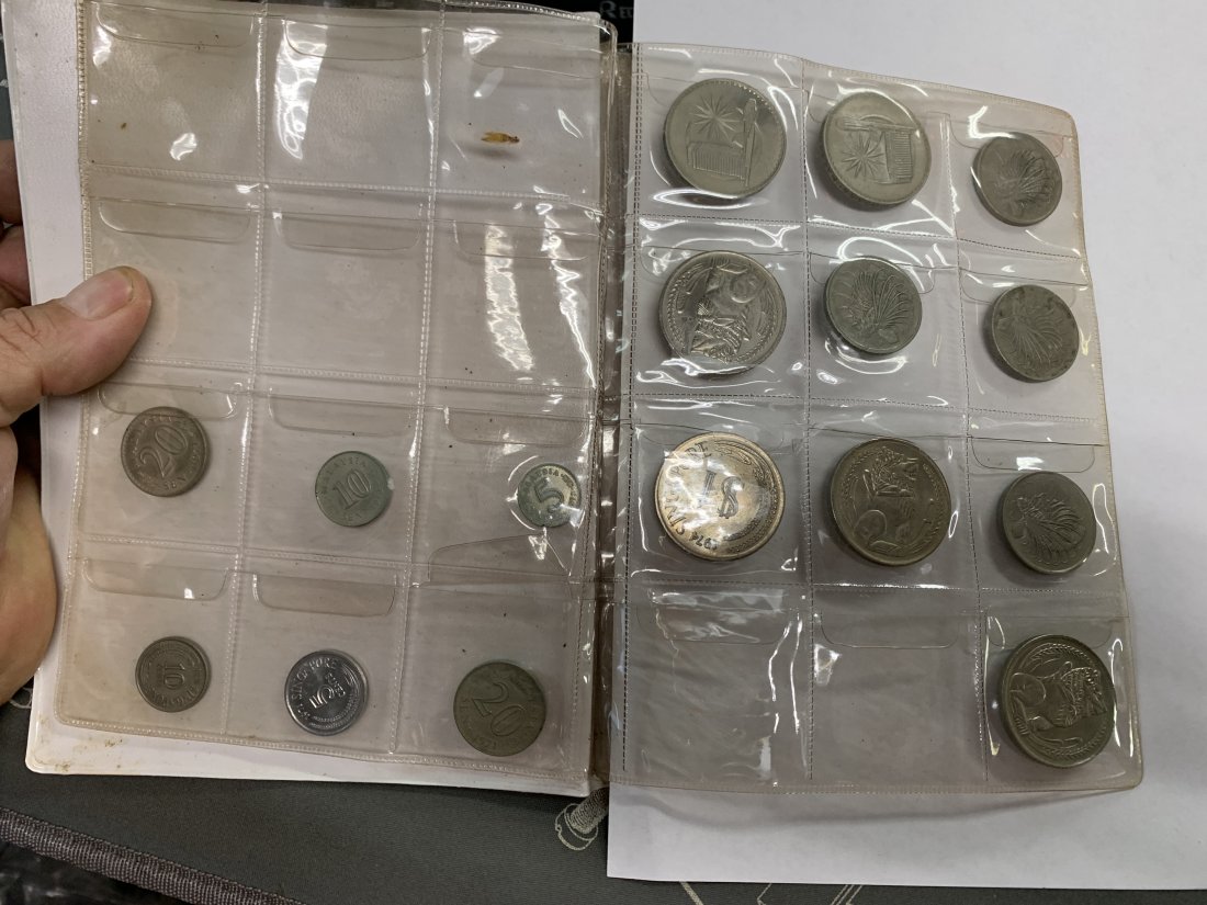 malaysia and singapore 29 coins: dollars and 50 cent pieces and a few others see pictures and ask questions if need be. i see coins dated 1971 1974 1975 1972 1973