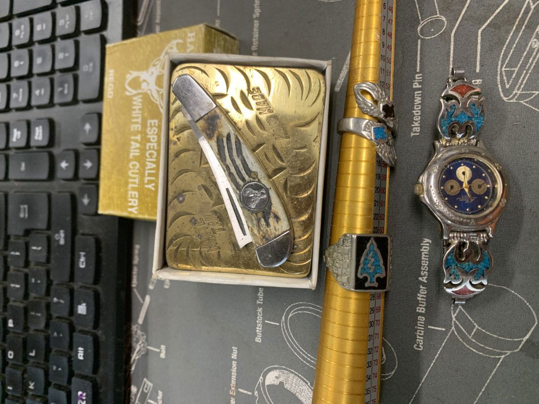 BELT BUCKLE AND RINGS THE RINGS: THE RING SIZER TOOL IS NOT INCLUDED JUST USED SO YOU CAN SEE THE SIZE. THE WATCH DOES NOT WORK EITHER. THESE ARE NOT STERLING IN MY OPINION. USE PICTURES AND ASK QUESTIONS BEFORE YOU BID OR BUY .WE WI