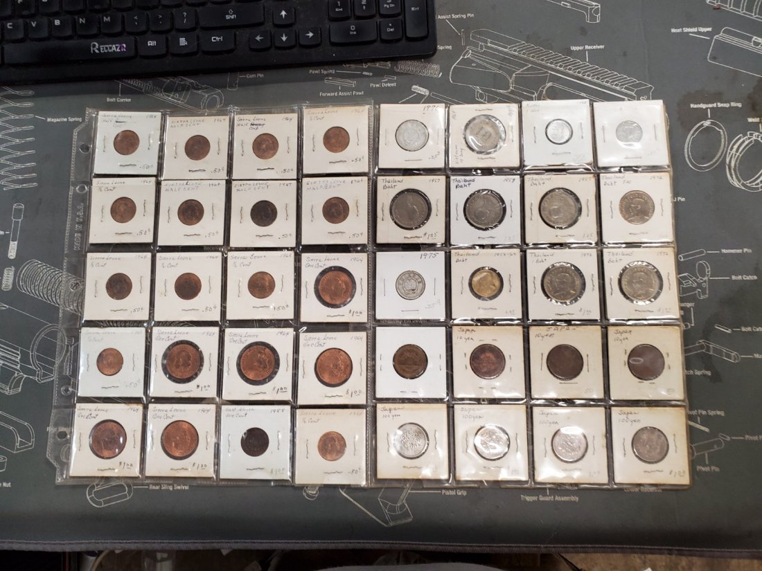 S. LEONE, E. AFRICA, VIETNAM, S KOREA, THAILAND, JAPAN+: TWO SHEETS FULL OF COINS FROM A LOT OF COUNTRIES; SEE PICTURES FOR TYPE, COUNTRY, DENOMINATION. i AM NOT AN EXPERT! THERE MAY BE ANOTHER COUNTRY OR TWO IN THERE, SEVERAL NOT MARKED.I MAKE NO CLAIM OR 