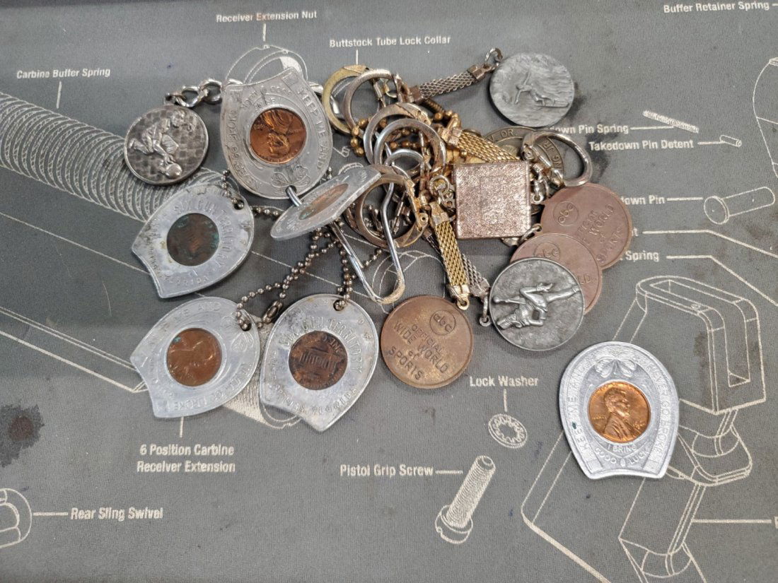 LUCKY PENNY AND OTHER CHARMS, KEYCHAIN PENDANTS: MISC COIN PENDANTS AND KEYCHAIN THINGS; SEE PICTURES! I MAKE NO CLAIM OR HAVE NO KNOWLEDGE OF COINS. MY OPINION AND HIS DOES NOT COUNT, BUT YOU MAY WANT TO USE HIS OPINION AS A GUIDE. HE WAS AN AVID C