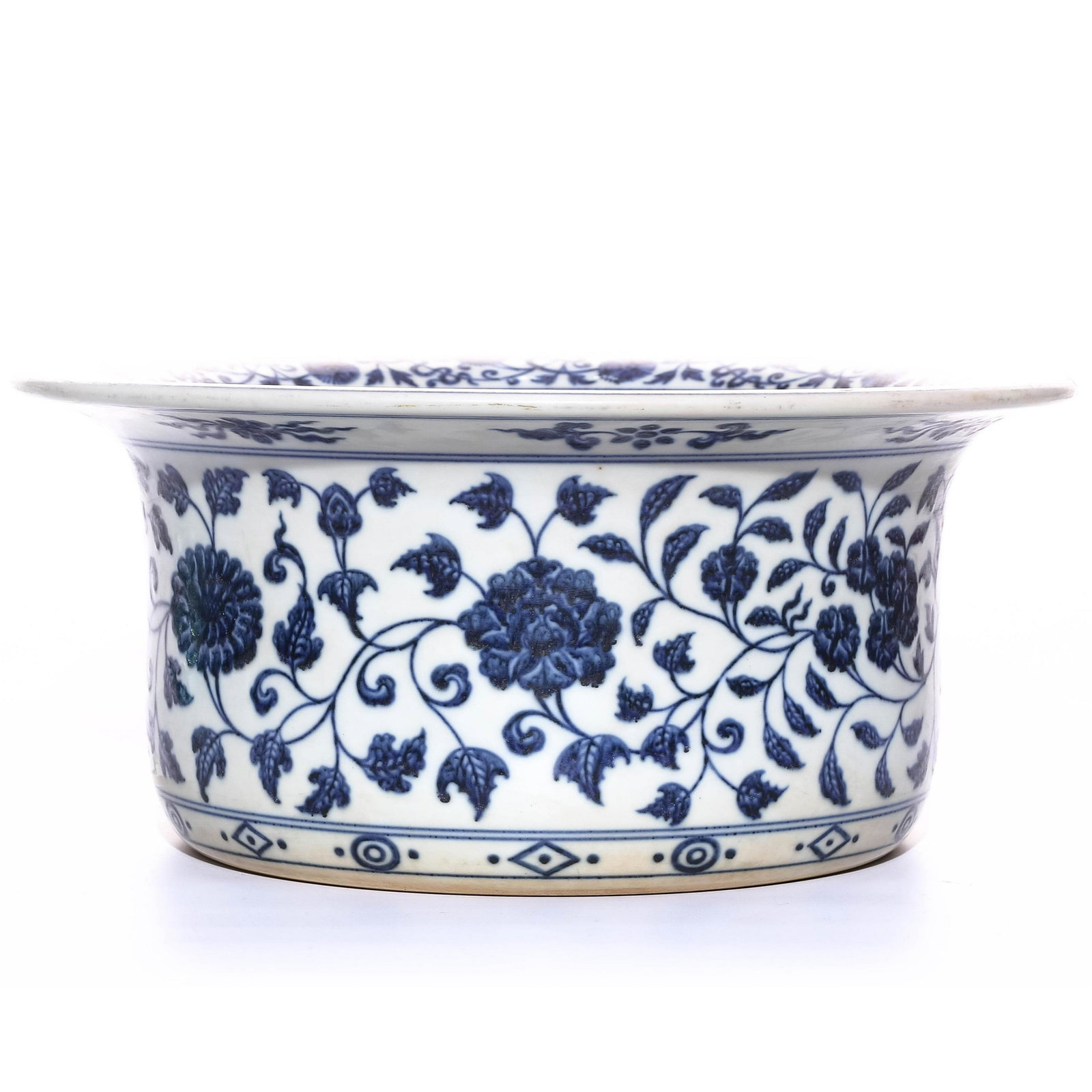 A CHINESE BLUE AND WHITE PORCELAIN: Ming Dynasty XuanDe period The bowl with a cylindrical body up to a sharpe wide out reaching opening rim.All reserved in clean white underglaze base colour which contrast against the cobalt fine blue 