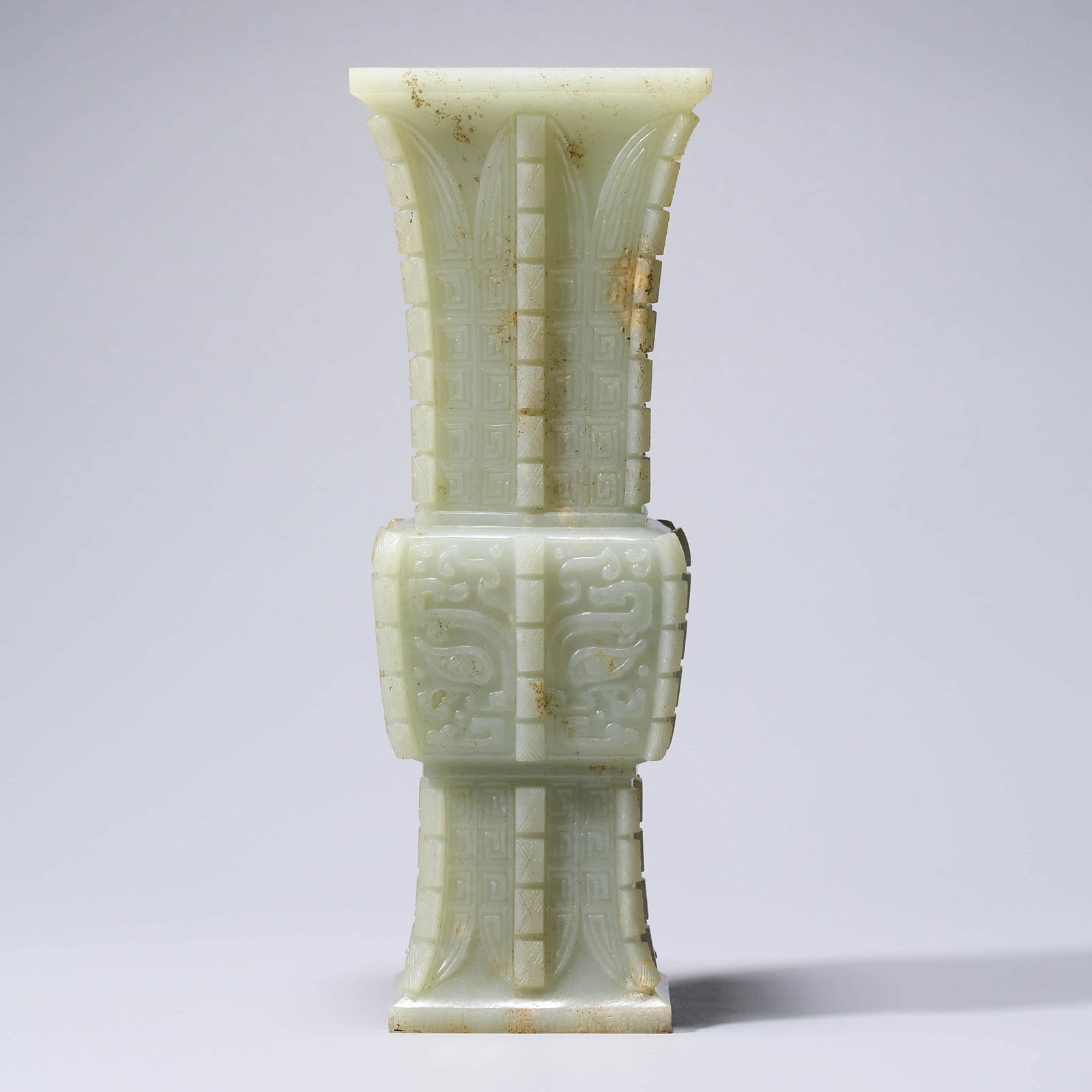AN ARCHIASTIC JADE BEAKER VASE: Dimensions: Length: 9.2cm x Width: 7cm x Height: 24.5cm PROVENANCE: From the Private Collections Estate of Gerald A Hagan (1930-2019) of Georgia. Formerly from Dayton, Ohio, a Korean War Veteran, ASAF