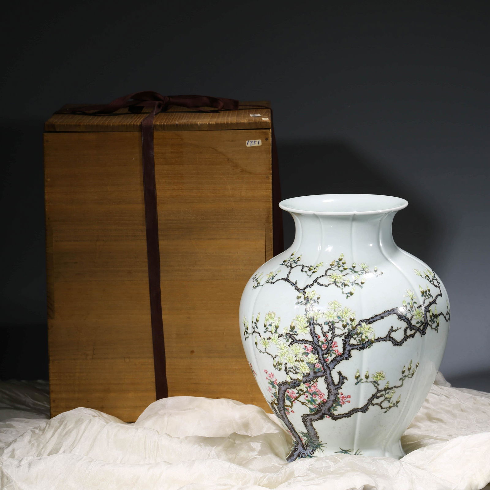 A CHINESE FAMILLE ROSE PORCELAIN VASE & WOODEN BOX,: Dimensions: Diam.25.8cm, Height: 32.8cm, Freely painted to each of the five gently lobed segments, the body of the vase is decorated with plum blossoms.Comes with a wooden box.