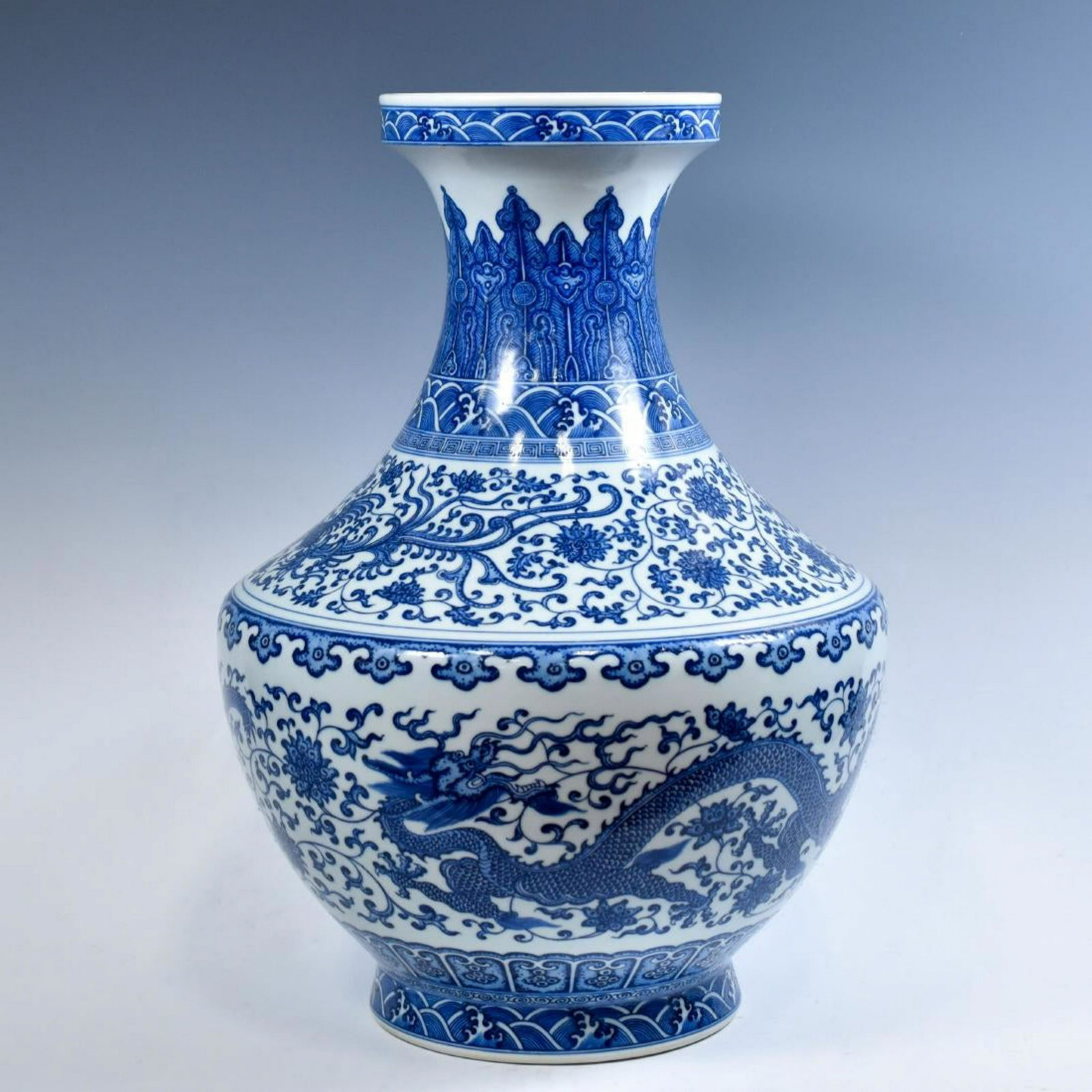 LARGE CHINESE BLUE & WHITE DRAGON LOTUS ARROW VASE: Dimensions: 20-1/2" H x 13-1/2" Dia Large Chinese blue and white arrow vase of Bulbous body, waisted tall neck with flared rim, with squared shoulder, raised on a concave splayed foot base. The exteri