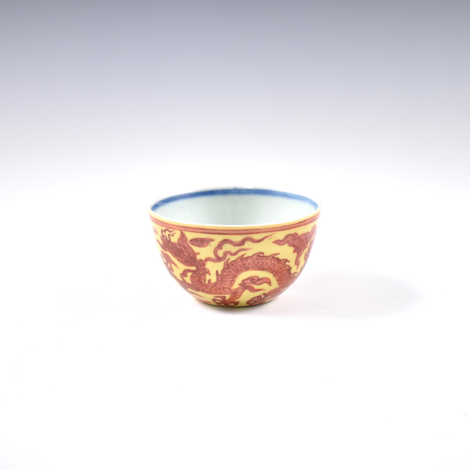 MING JIAJING RED DRAGON OVER JAUNE GROUND BOWL: Dimensions: 2-3/8" H x 4-1/4" Dia. Chinese Ming Dynasty Period, JiaJing yellow red bowl. The porcelain potted with a shallow body, slight deep, broad cavetto, with a straight opening lip, raised on a