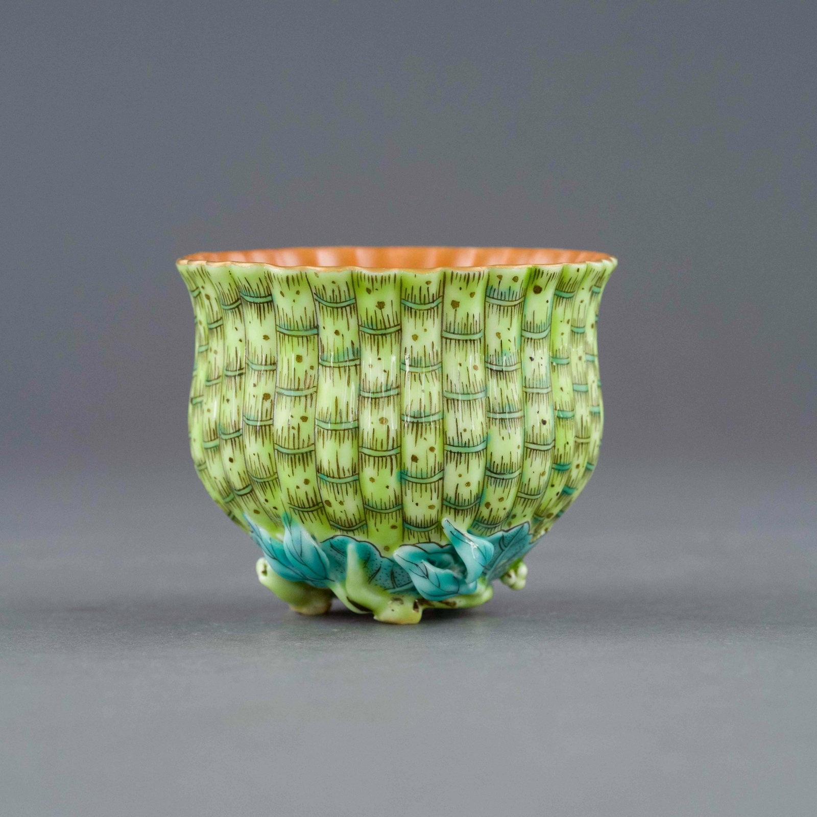 YONGZHENG BAMBOO MOTIF FAMILLE VERTE CUP: Dimensions: 2.75in H x 3.25in W x 3.25in D Chinese Qing Dynasty Period Yongzheng bamboo motif famille verte cup. The porcelain potted with a bulbous body, of a deep vessel, broad wide cavetto, with a 