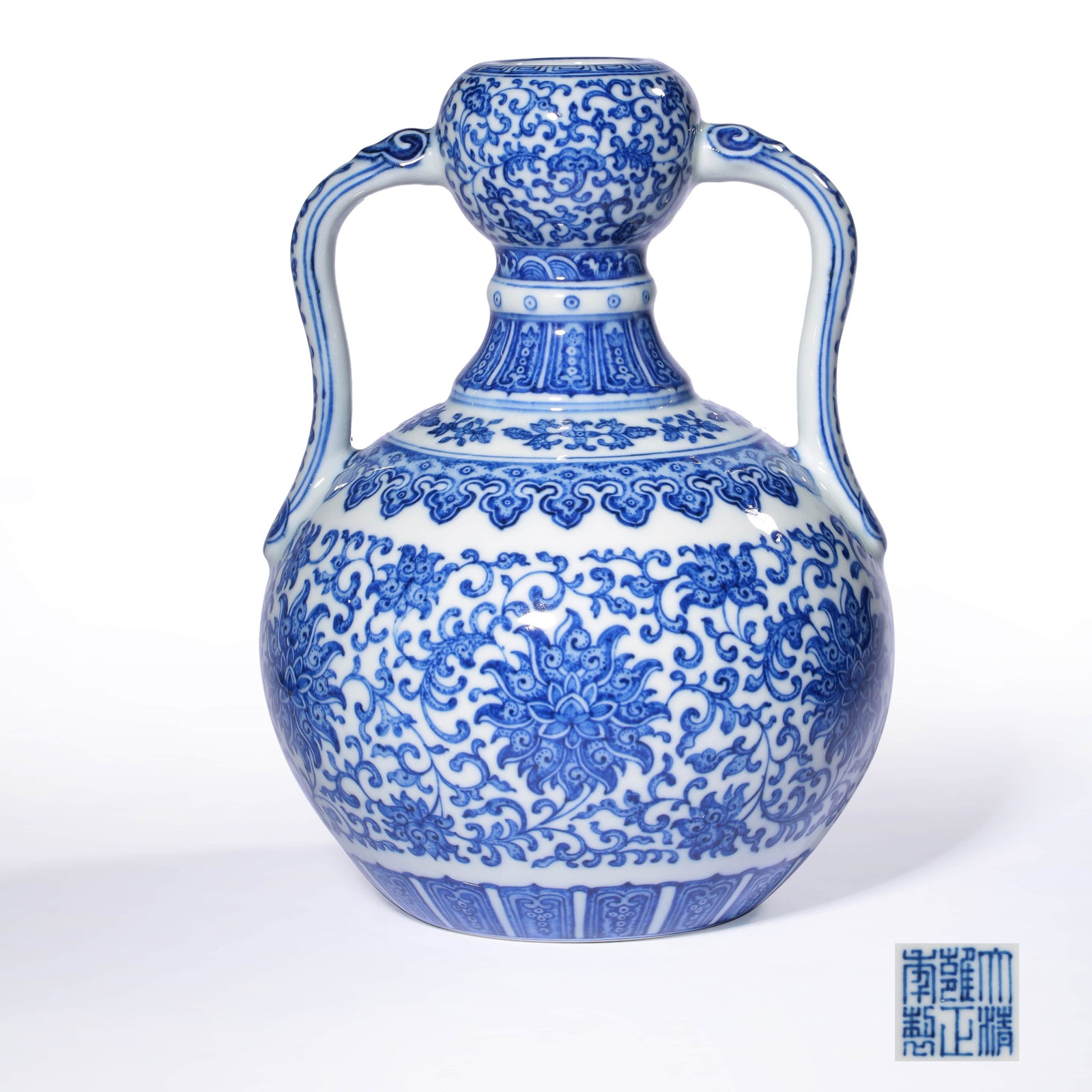 A BLUE AND WHITE TWINING LOTUS PATTERN RIBBON: A Blue and White Twining Lotus Pattern Ribbon Porcelain, Zun. Height: 23cm,