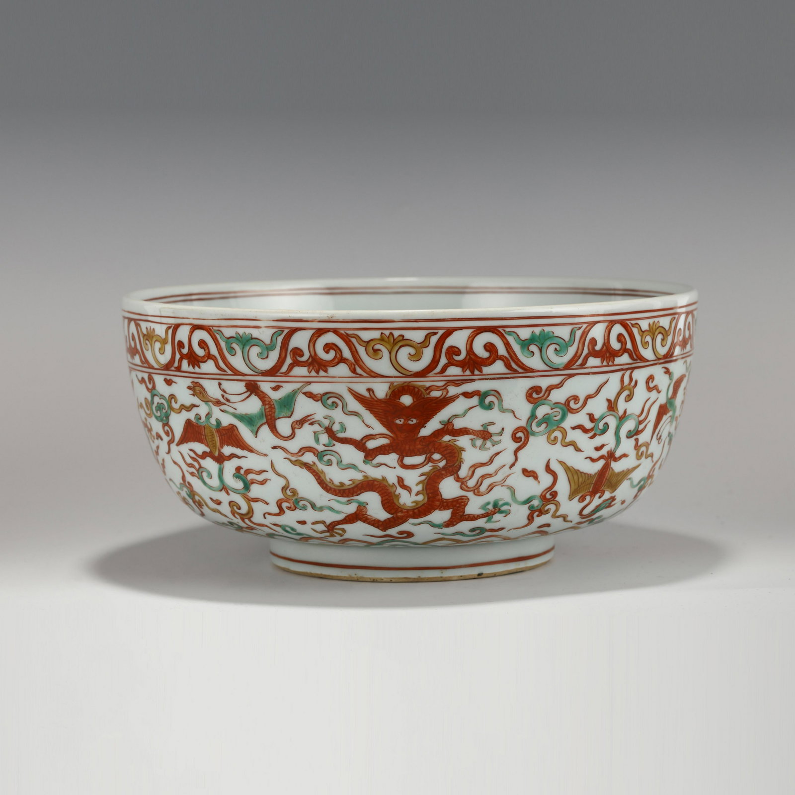 MING LONGQING THREE-COLOR DRAGON BOWL: Dimensions (cm): Heigth: 14.7ã€€Diam.: 32 Chinese Ming Dynasty LongQing Three Color Dragon Porcelain Bowl. The bowl has an open mouth, rounded lip rim, thick, deep arced body, raised with round f