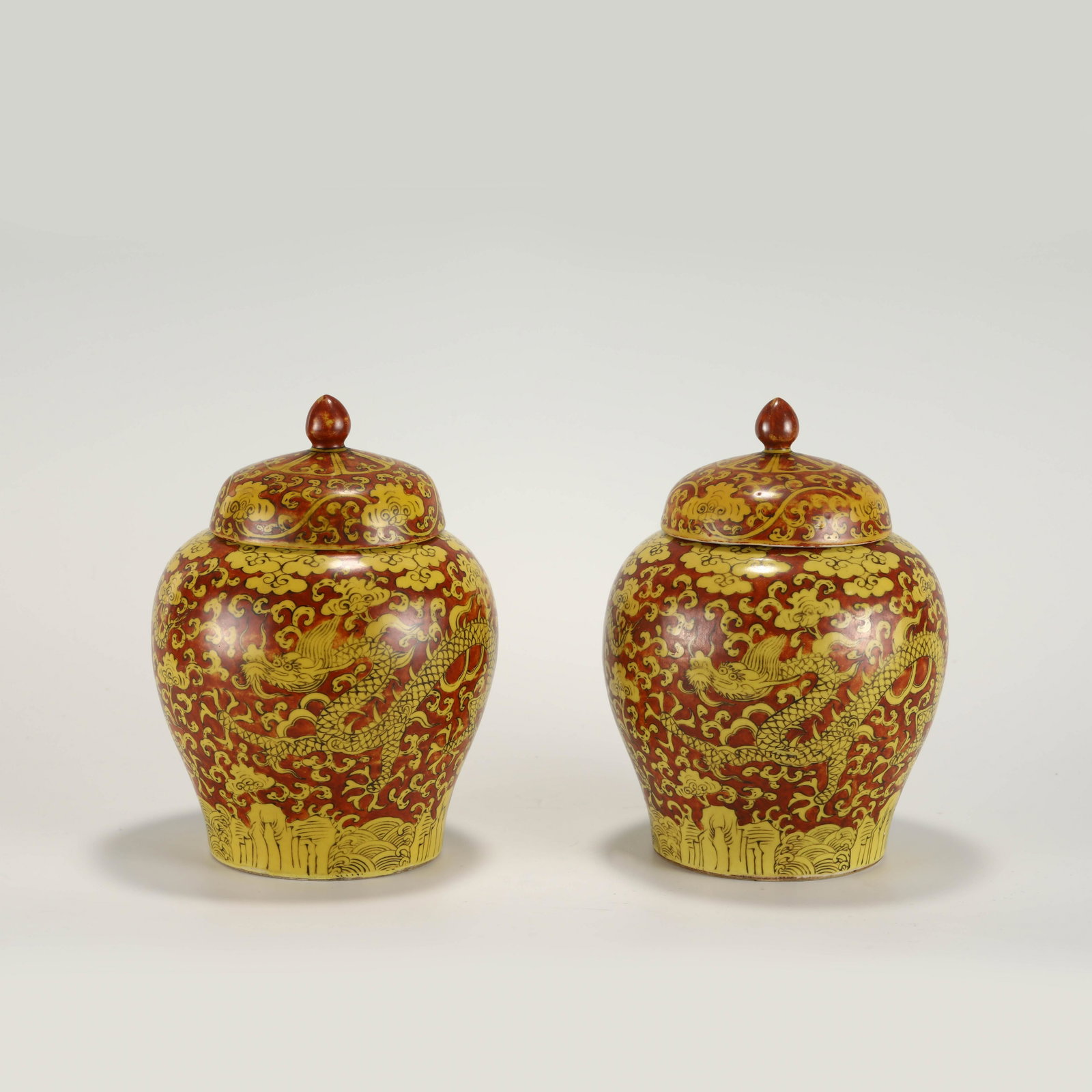 MING JIAJING YELLOW AND RED GLAZED LIDDED JARS: PROVENANCE: From Farragut, TN Private Collector. Dimensions: Heigth: 21 cm, Diameter: 15.6 cm Pair of Chinese Ming Dynasty JiaJing Yellow And Red Glazed Dragon Porcelain Lidded Jars. Potted into jars 
