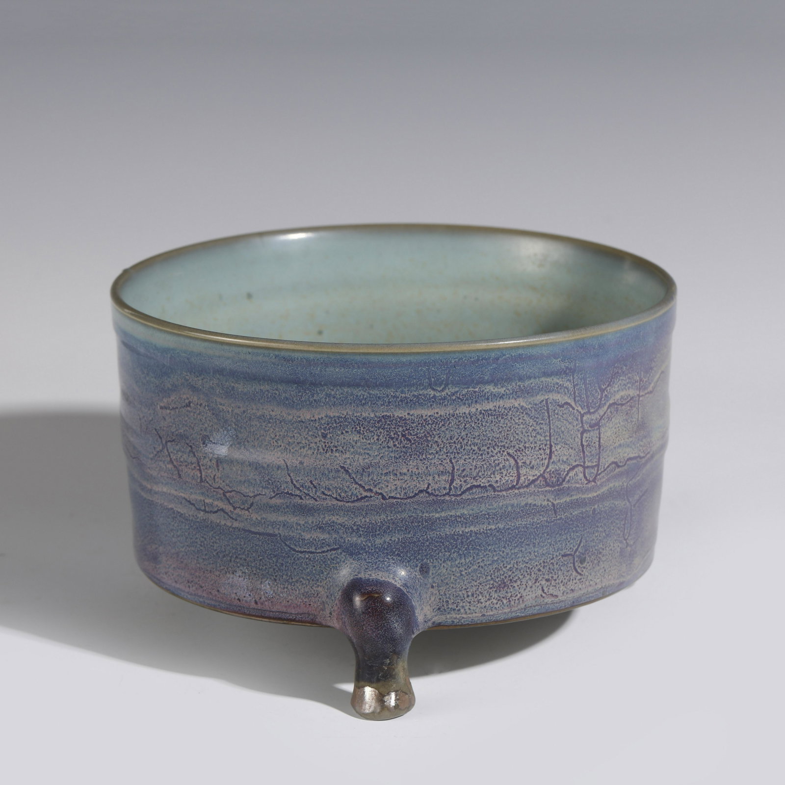 SONG JUN KILN TRIPOD INCENSE BURNER: Dimensions: Width: 19cm, Height: 12cm Chinese Song Dynasty Jun Kiln Porcelain Incense Burner. Potted in shallow vessel form, thick and deep, globular body, round opening mouth lip, raised with short t