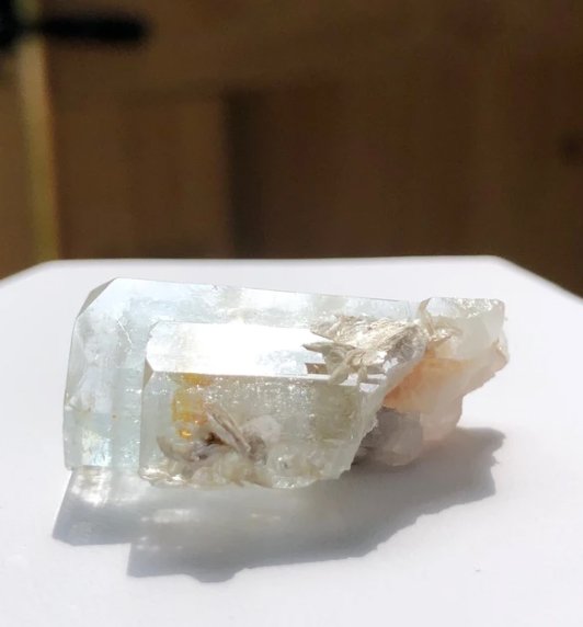 Aquamarine Specimen: Nice small gemmy specimen broken base. Some surface etching. Mica inclusions on surface. Gilgit District - Pakistan. 12.5 Grams. Approximately 30mm X 20mm X 20mm.