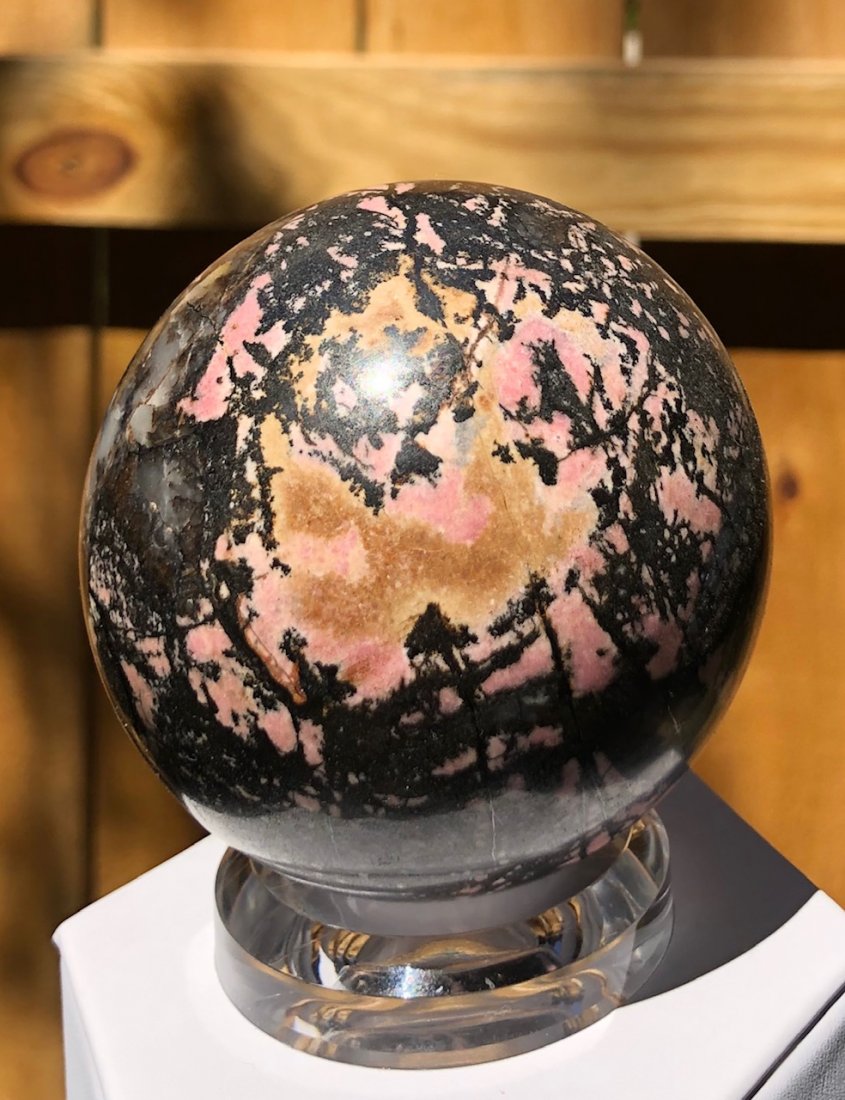 Rhodonite Sphere: Rhodonite sphere. 75mm. 688 Grams.